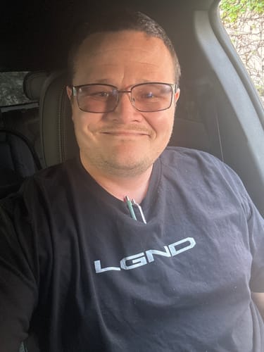 Customer wearing a black LGND logo t-shirt from their Limited LGND89 Mystery CASH Box.