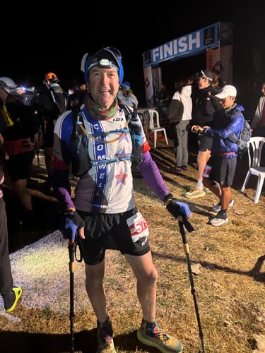 Reviewer in black RUNNR 2-in-1 Running Shorts after finishing a 100-mile night race.