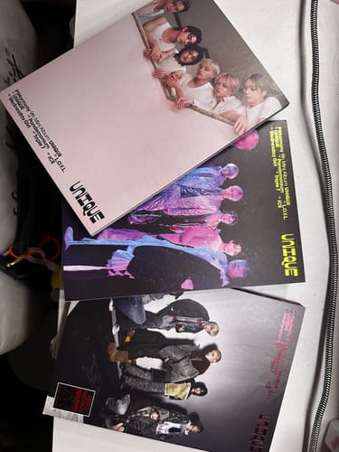 Reviewer displays the three different album covers from the P1HARMONY UNIQUE! 9th Mini Album Compact Ver Set.
