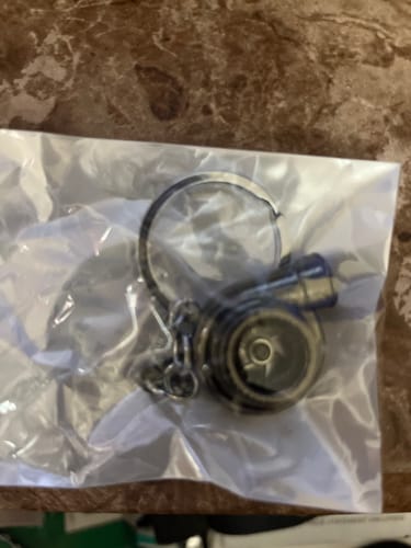 Close-up: Customer's TURBO KEYCHAIN inside its clear plastic packaging.