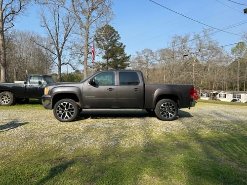 Customer's gray GMC Sierra truck shown before installing the 3" front leveling lift kit.