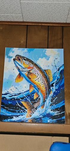 Reviewer's finished Leaping Trout paint by numbers painting showing a colorful trout leaping from the water.