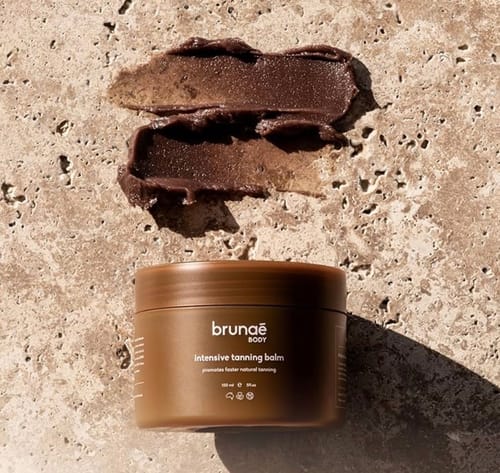 Customer's Intensive Tanning Balm in a brown jar, with two smears showing the product's thick texture.