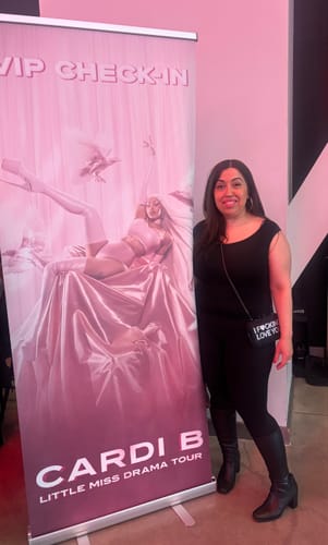 Reviewer wearing the black IFLY Rhinestone Clutch crossbody style at an event.