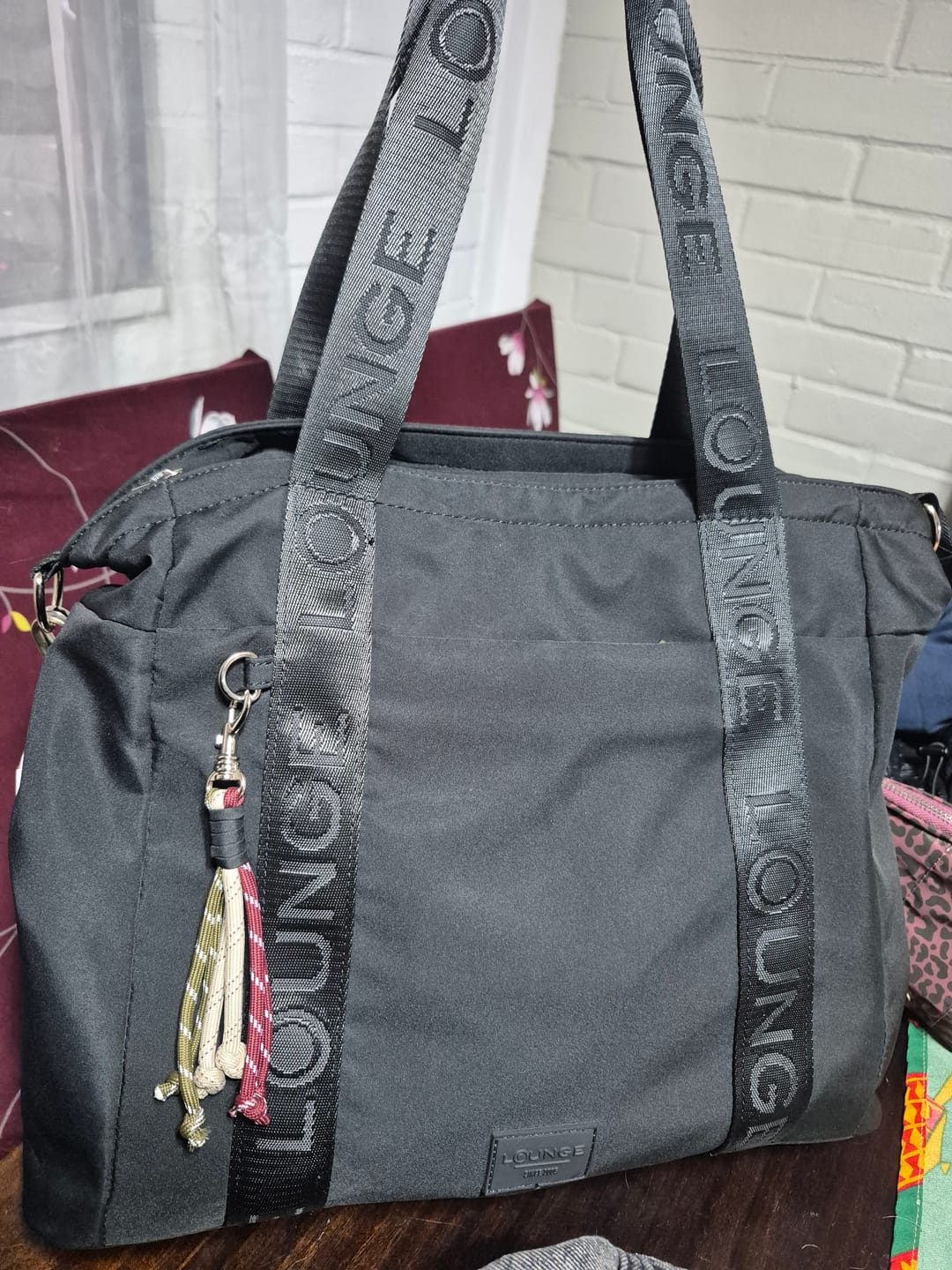 Customer photo review of Bolso Nylon Llavero Street