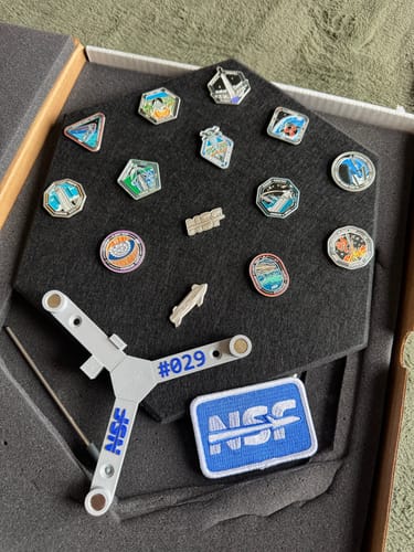 Customer's SpaceX Starship Pin Collection showing the hexagonal display, pins, and serialized mount (#029) in its original box.