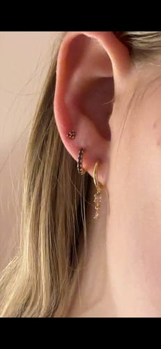Reviewer showing their ear stack featuring the Everyday Ear Party Lilac/Gold earrings.