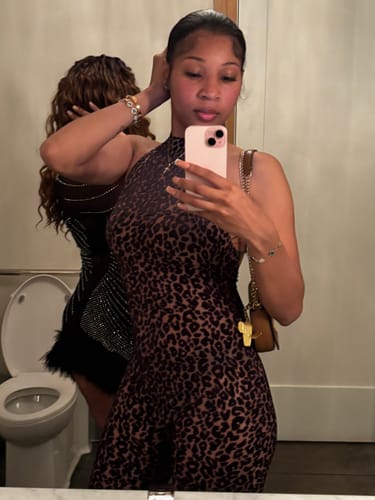 Close-up of a reviewer in the burnout print halter capri jumpsuit, highlighting the halter neckline and pattern.