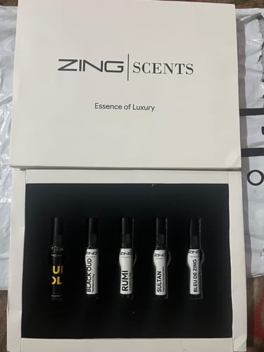 Customer's open Zing Scents DISCOVERY BOX, showing the five included perfume testers in their packaging.