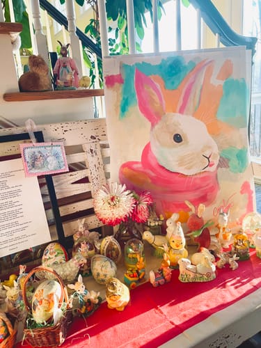 Customer's finished Pastel bunny painting displayed as part of an adorable Easter vignette with other decorations.