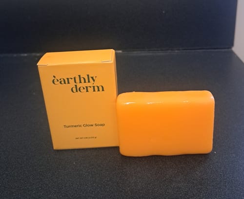 Customer's orange Turmeric Fade & Glow Bar shown next to its product box.
