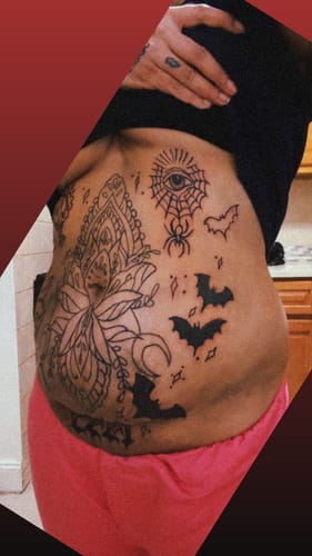 Reviewer showing their large stomach tattoo in progress after using Painless Tattoo Numbing Cream.