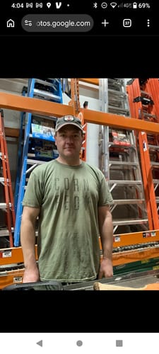 Customer who reports feeling stronger after taking 19-Nandro, shown standing in a warehouse-style store.