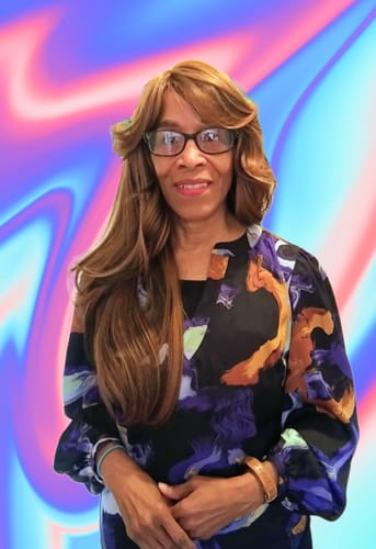 Reviewer wearing the long, layered Amore Mio Full Wig with a side part and soft, face-framing curls.