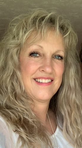 Customer smiling, showing the results of wearing My Amazing Lashes Mascara on her long lashes.