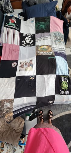 Reviewer's memorial Premium T Shirt Quilt laid out, made with various shirts and a printed family portrait.