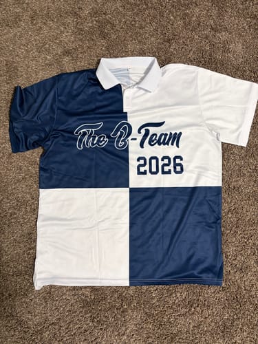 Customer's custom performance polo shirt with a navy and white four-square design, showing 'The B-Team 2026' on the front.