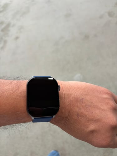 Customer wearing the Health smartwatch 3 with a blue strap on their wrist. The screen is turned off.