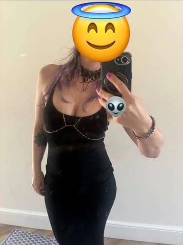 Customer showing the body-contouring fit of the black Slip Maxi Shapewear Dress in a mirror selfie.