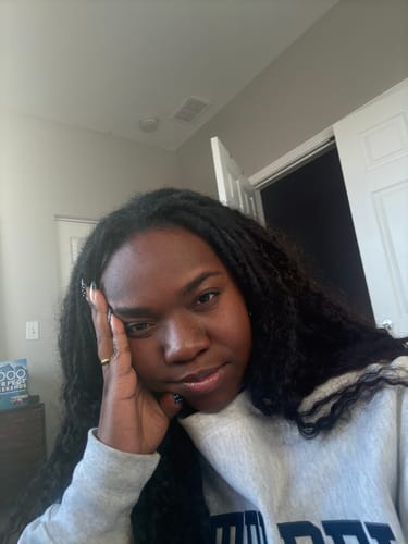 Reviewer showing their long, full Water Curly Human Crochet Hair installation indoors.