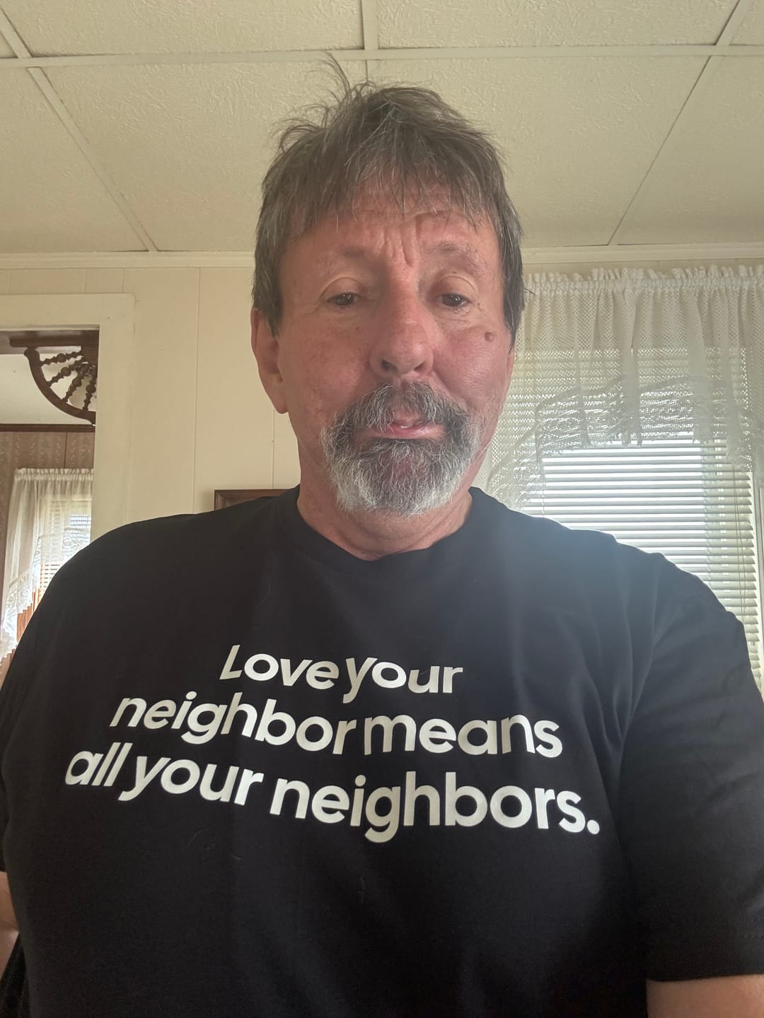 Customer photo review of Love Your Neighbor Means All Your Neighbors Unisex Tee