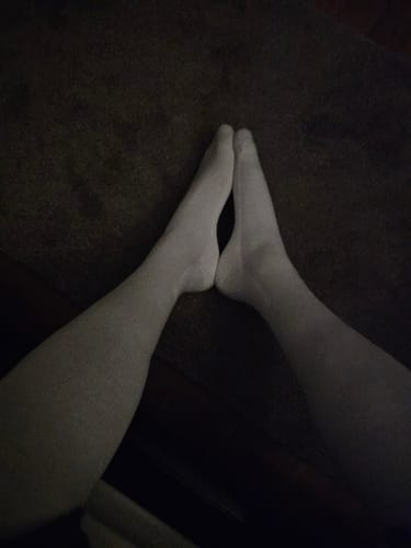 Reviewer's legs wearing a pair of light-colored Performance Eucalyptus Compression Socks.
