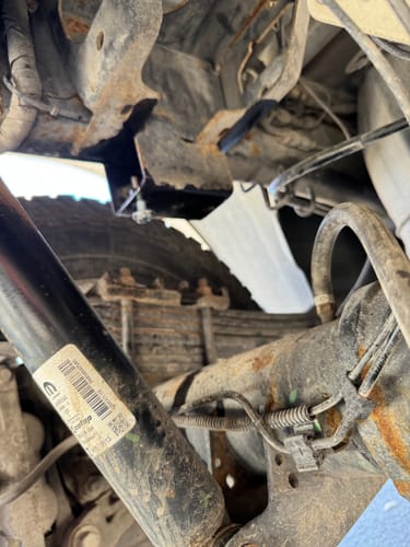 Customer's view of the truck frame where the factory bump stop was removed before installing the new part.