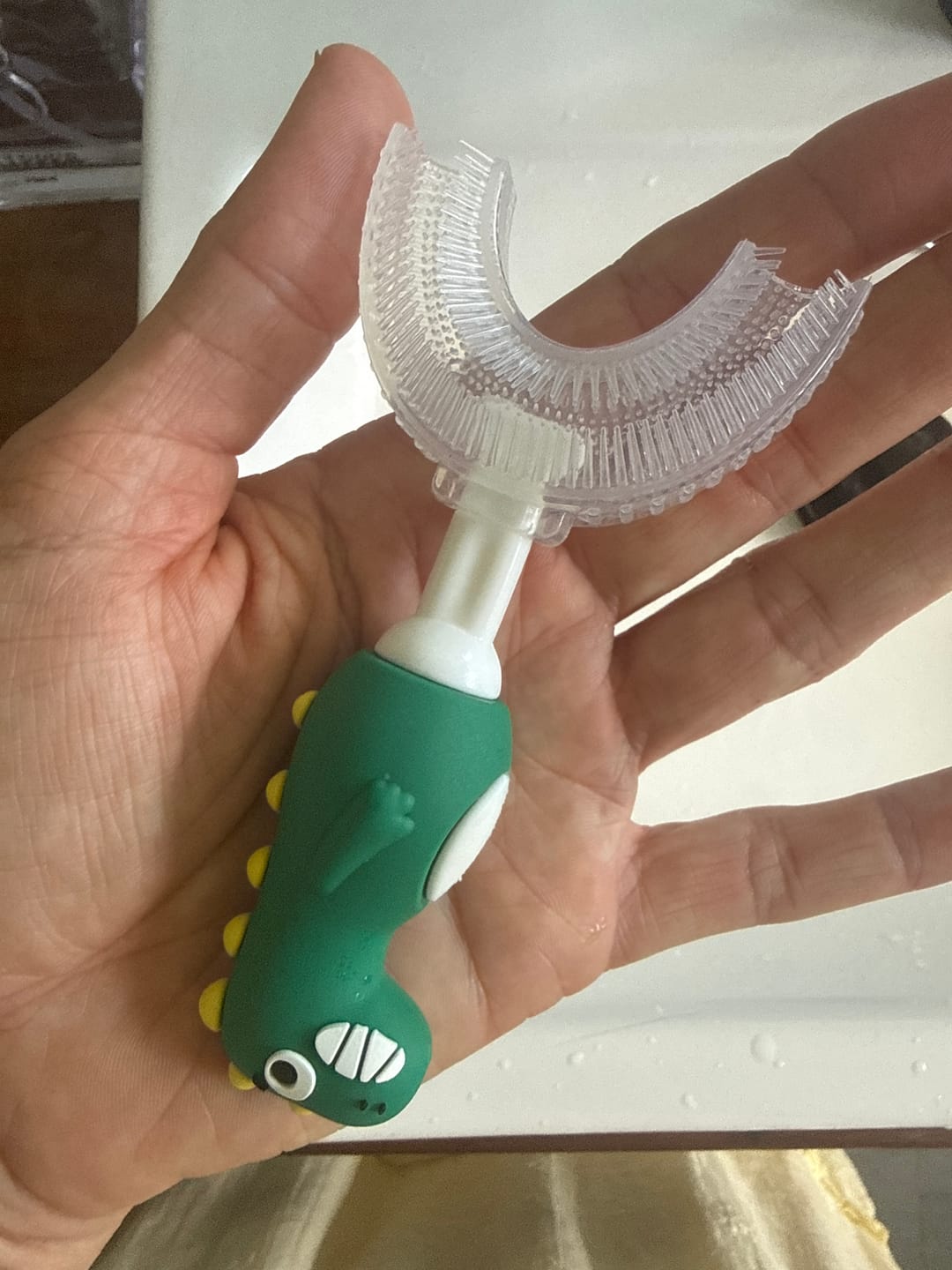 Customer photo review of Cheeky Dinosaur U-Shaped Toothbrush Child Green