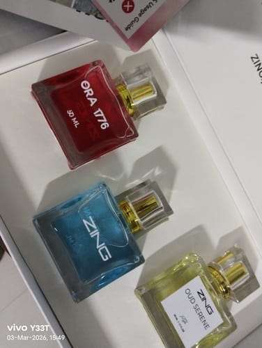 Customer's OUD Supreme BUNDLE showing three colorful, square perfume bottles inside the product box.