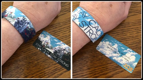 Reviewer's split image of the Tiger Bracelet showing the outer tiger art and inner 'Stay Calm, Stay Strong' text.