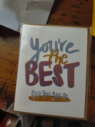Customer's "You're the BEST. Keep that shit up" card, shown in its clear packaging.