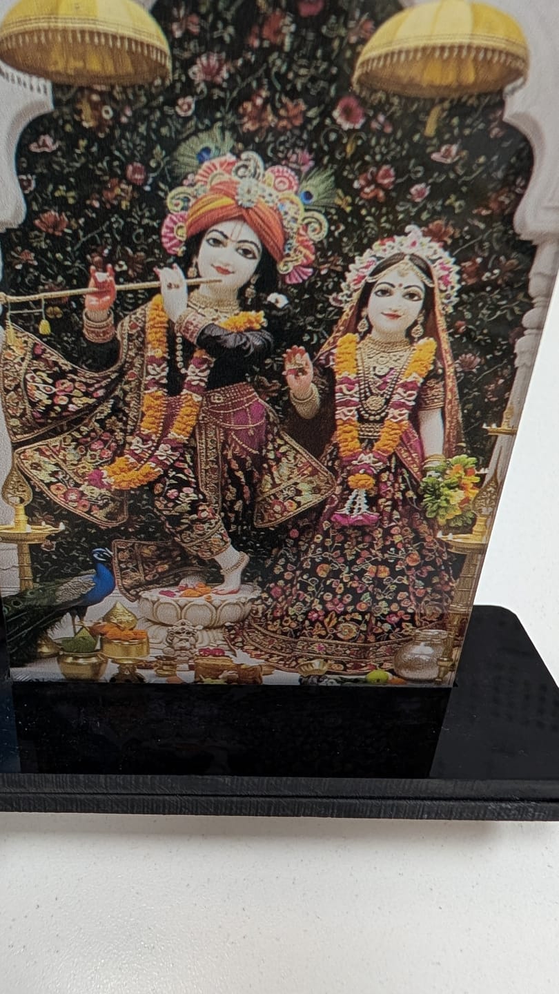Customer photo review of Radha Krishna Acrylic Car Dashboard- 2.5×3.5"