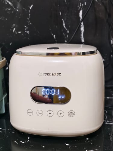 Customer's white Eurohauz Healthy Rice Cooker on a counter, showing its modern digital control panel.