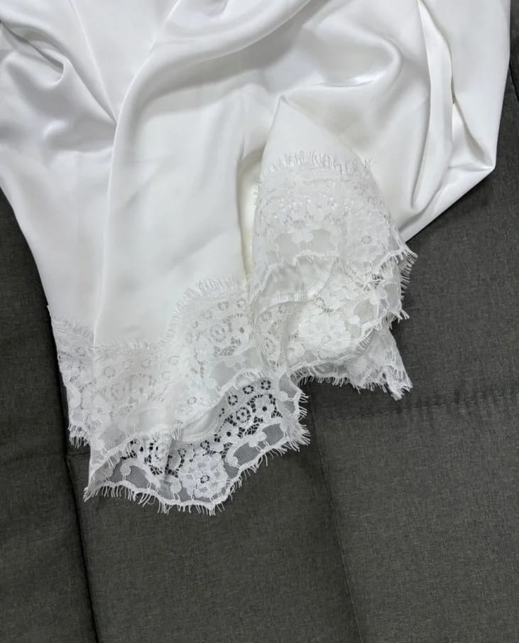 Customer photo review of Elara Asymmetrical Long Sleeve Lace Hem Top
