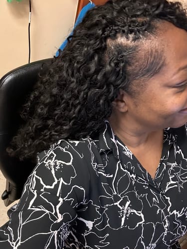 Reviewer's side view showing the installed Ywigs Water Wave Human Crochet Hair with its soft, wavy texture.