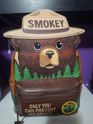 Customer's Smokey Bear Cosplay Mini Backpack. The front shows the bear's face, ranger hat, and wildfire prevention slogan.