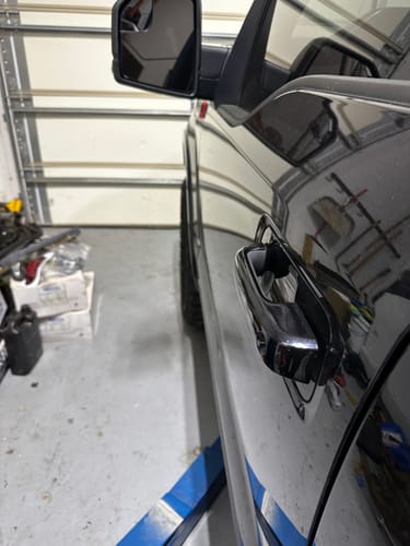 Customer's black truck showing a wider wheel stance after installing 1.5" hubcentric wheel spacers.