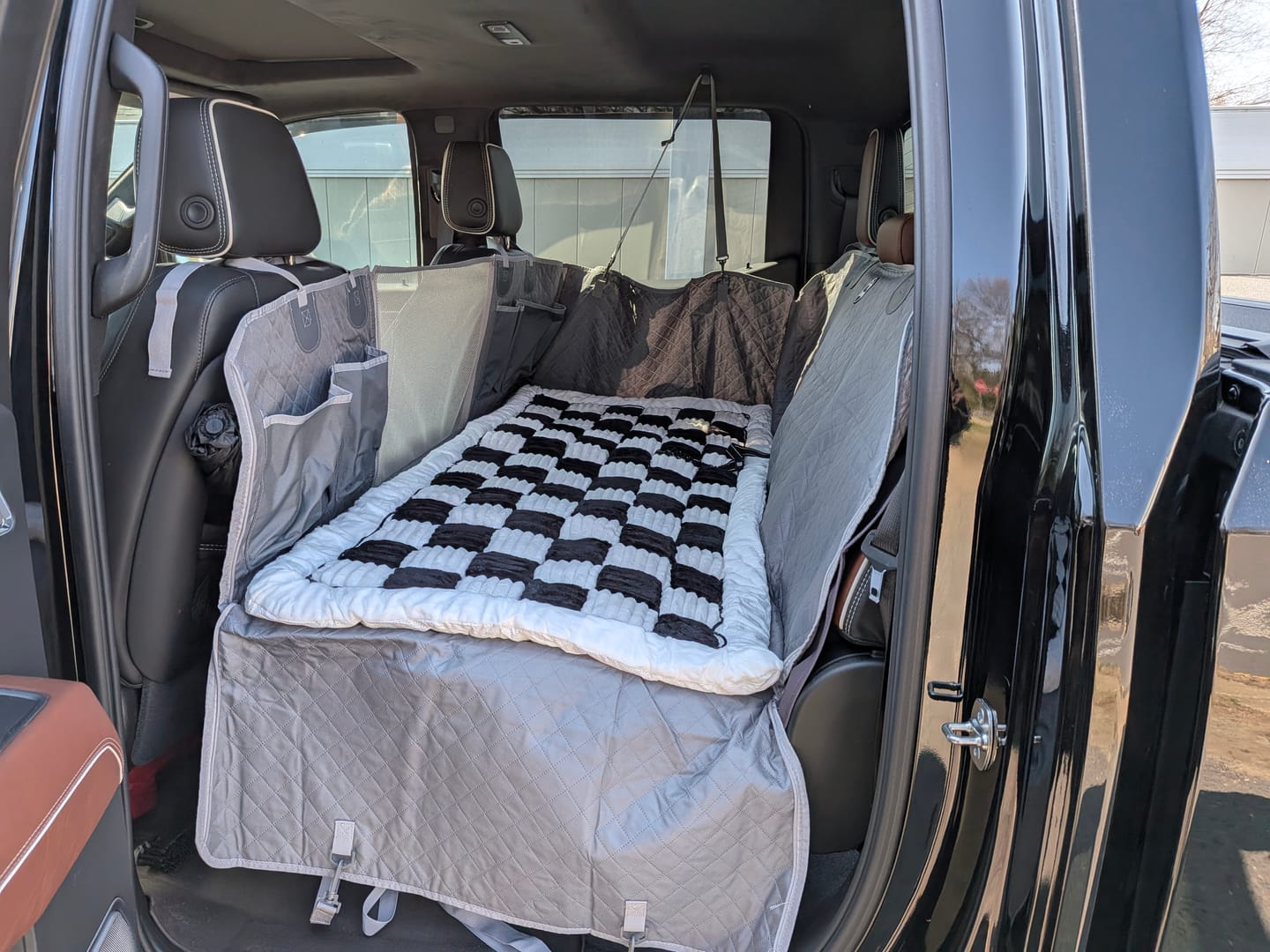 Customer photo review of NEW Waterproof Hard Bottom Car & Truck Seat Foldable Hammock Cover With Storage Pockets, Side Flaps, Headrest Straps, Seat Anchors, & Mesh Window (+FREE SAFETY BELT!)