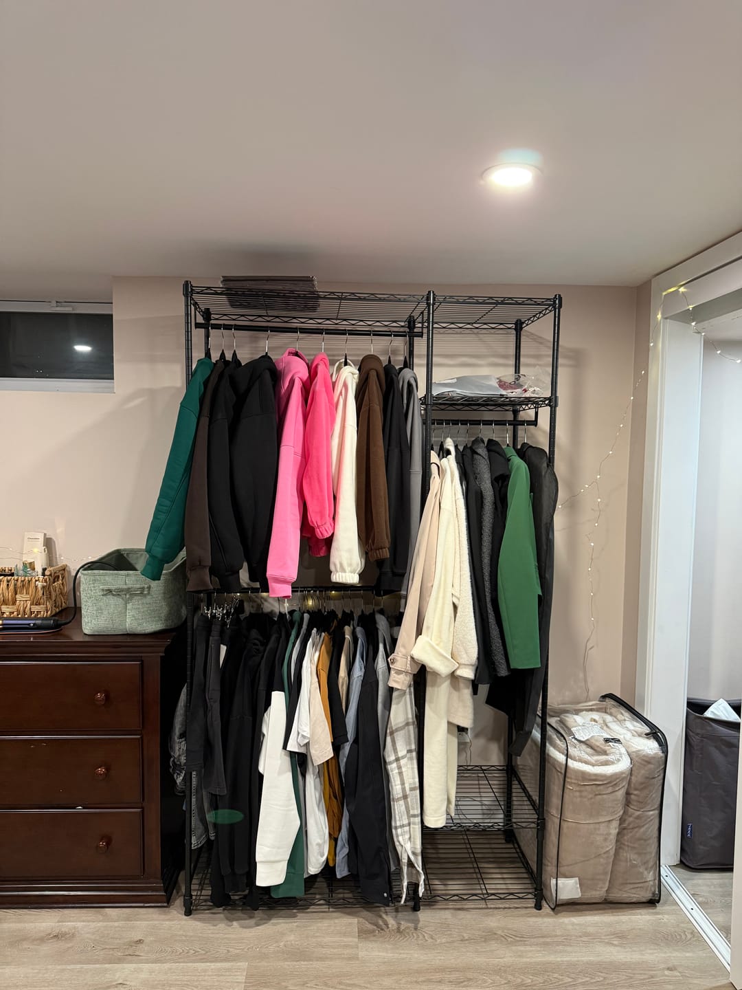 Customer photo review of Raybee Heavy Duty Portable Clothes Rack With Wheels,Clothing Rack For Hanging,Garment Rack For Bedroom