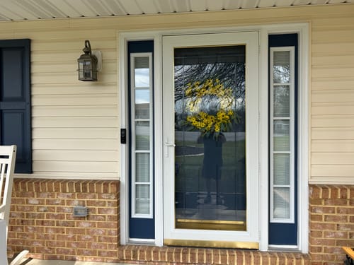 Customer's home showing two installed Clear 5 Lite Glass and Frame Kits as sidelites framing the front door.