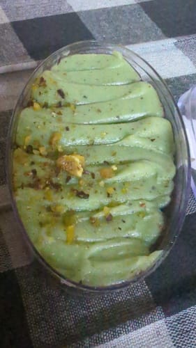 Customer's Dubai Viral Kunafa Jar, with a light green topping piped in rows and sprinkled with pistachios.