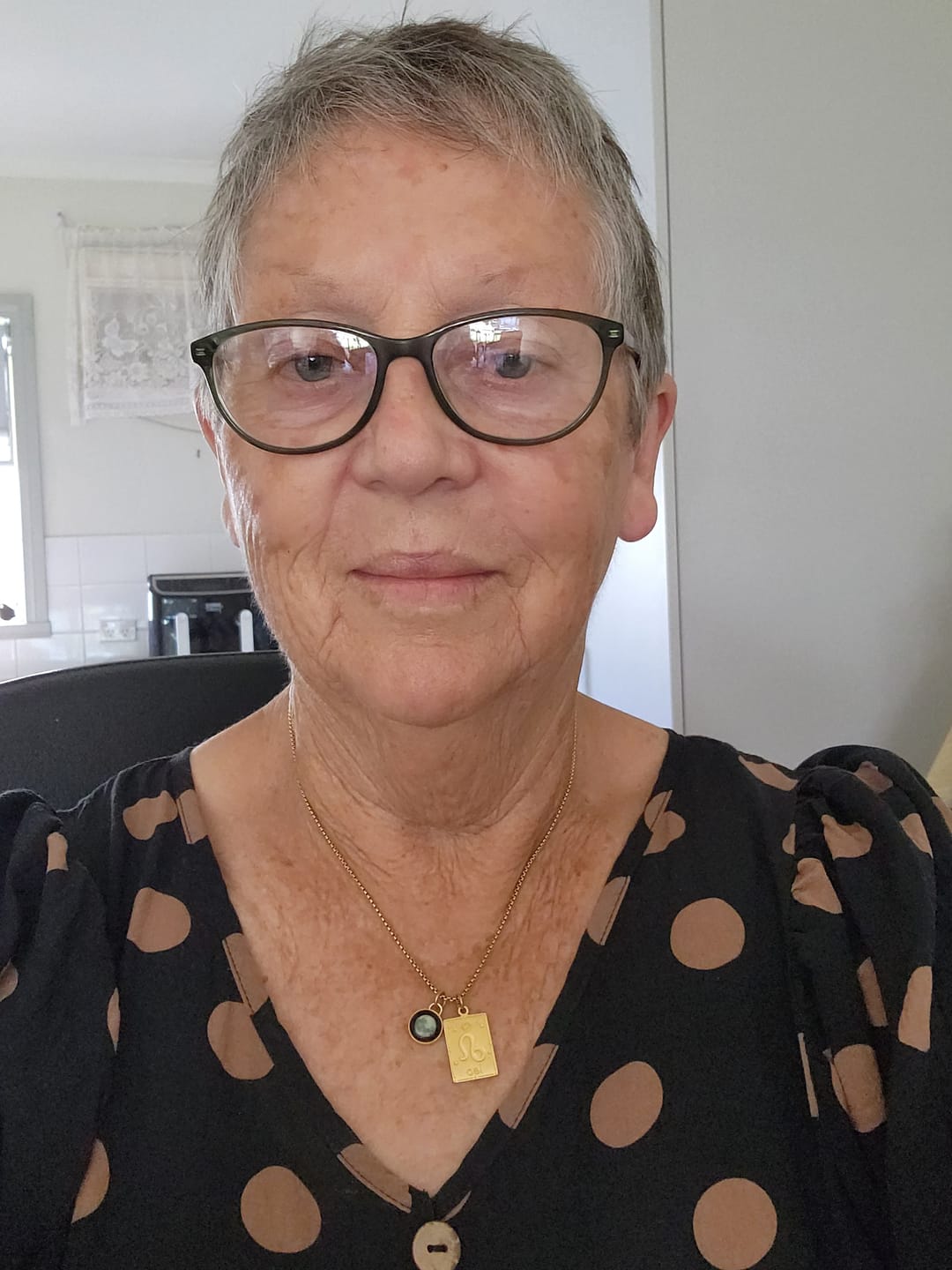 Customer photo review of The Oracle Zodiac Card Necklace in Gold