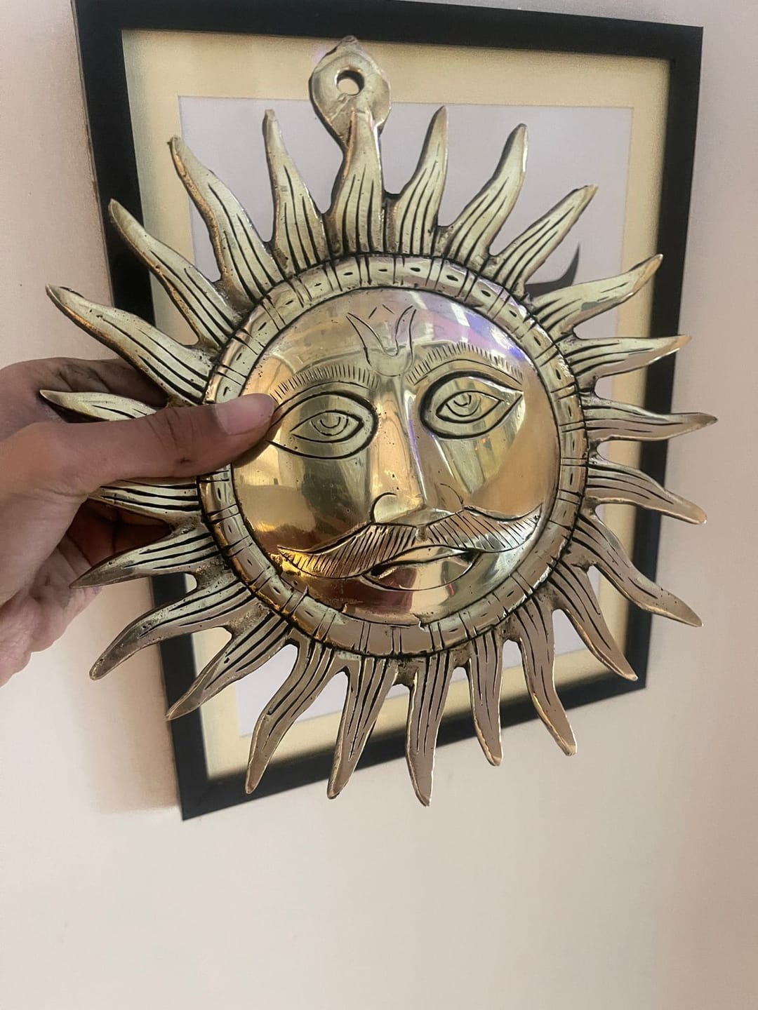 Customer photo review of Brass Surya (Sun) Ji Wall Hanging Idol Vastu Remedy for East Direction Balance, Fame and Positive Energy | 24 X 24 cm | 1 kg