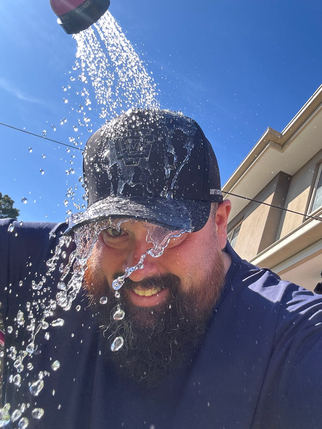 Customer photo review of ULTRA FIT Black Water-Resistant A-Frame Snapback