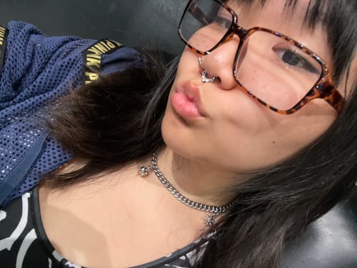 Close-up of a reviewer wearing the adjustable Spikeball Choker.