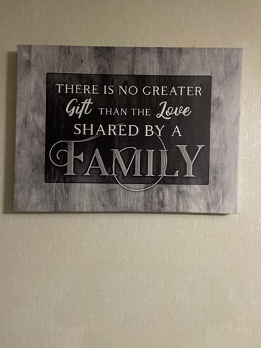 Reviewer's rectangular Family Wall Art with a grey wood-grain border hanging on a light wall.