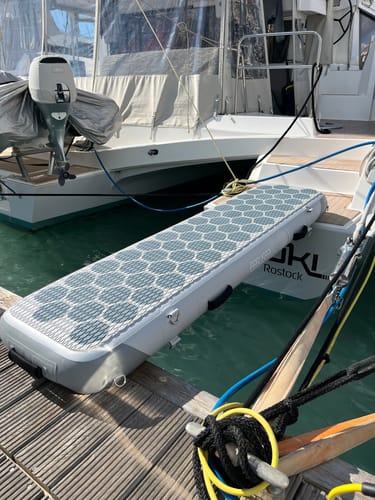 Customer photo: WAY2 inflatable gangway hooked to a catamaran in a marina