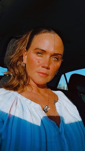 Reviewer wearing the Paloma Saturn Grey contact lenses, showing their light grey color in natural light.
