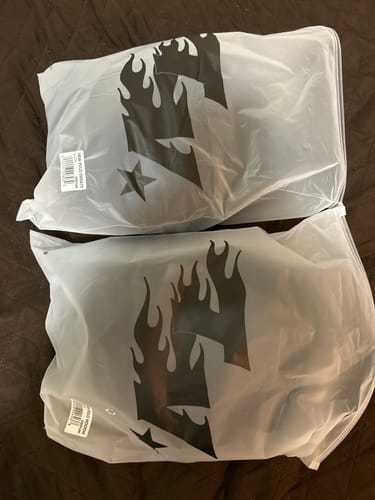 Customer shows the packaging for their MIDNIGHT SET, still sealed in two frosted plastic bags.