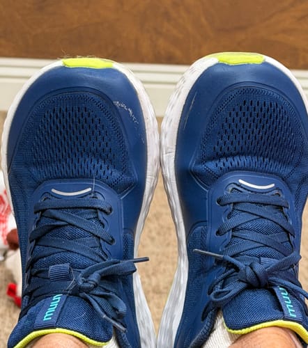 Customer's top-down view of their blue Flow Wide Toe Box Pickleball Shoes, showing scuffs on the left toe.